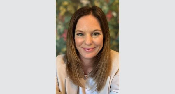 Headshot for Rose Cohen, with flowery background and grey border