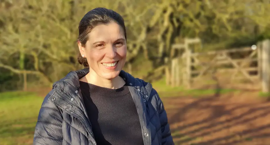 Professor Santos standing in the countryside